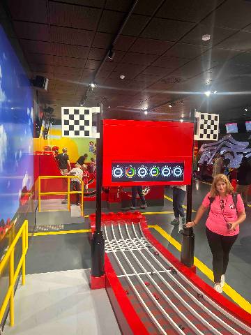 An interactive racing game exhibit in a themed indoor play area.