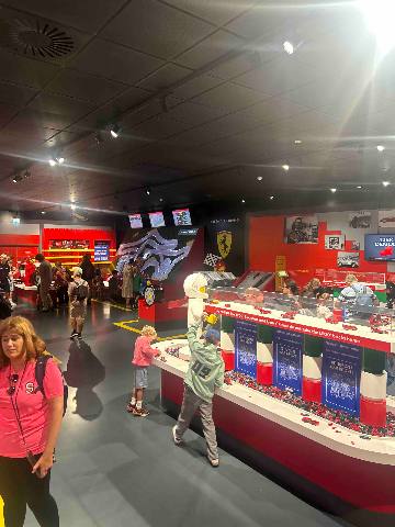 people building with plastic bricks at an indoor play centre