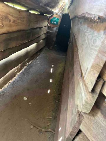 a wooden trench or defensive structure at a historical site