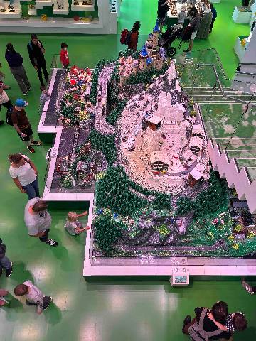 A detailed scale model mountain exhibit in a museum or theme park.