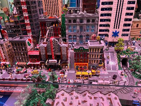 a detailed city scale model made of plastic building blocks