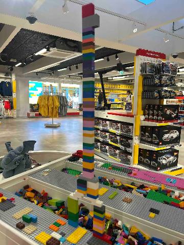 a toy store interior with a structure made of interlocking building bricks